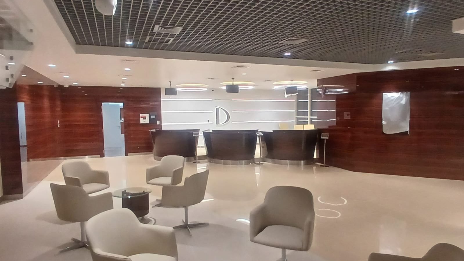 Completed banking hall with timber panelling, ceiling works and seating in Doha, Al Khor